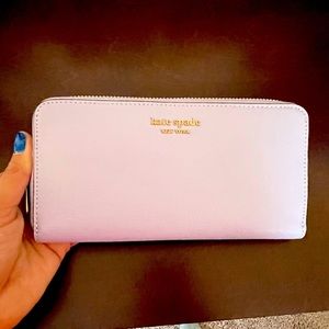 Brand new lavender wallet! Lots of room for cards and pockets with zipper